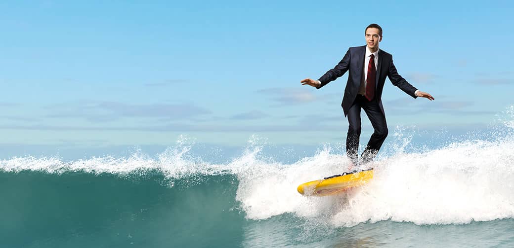 Photograph of businessman surfing