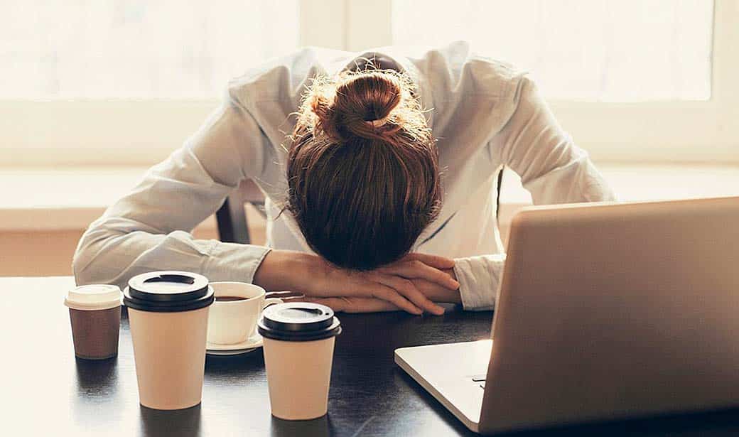 Photo of woman exhausted and stressed out.